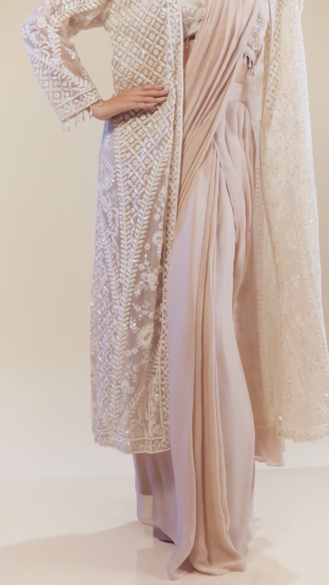 Heavy Embroidered Light Peach with Hand Detailing a Long Jacket With Bustier And Drape Saree Set